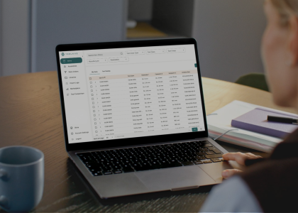 A person reviewing tool library data in Toolhive's cloud-based tool management software on a laptop