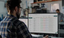 Programmer using Toolhive software to view and manage tool assemblies on a desktop monitor.